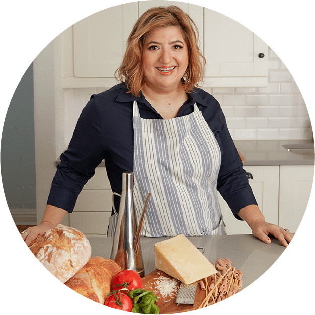 Michele Di Pietro in apron standing in kitchen