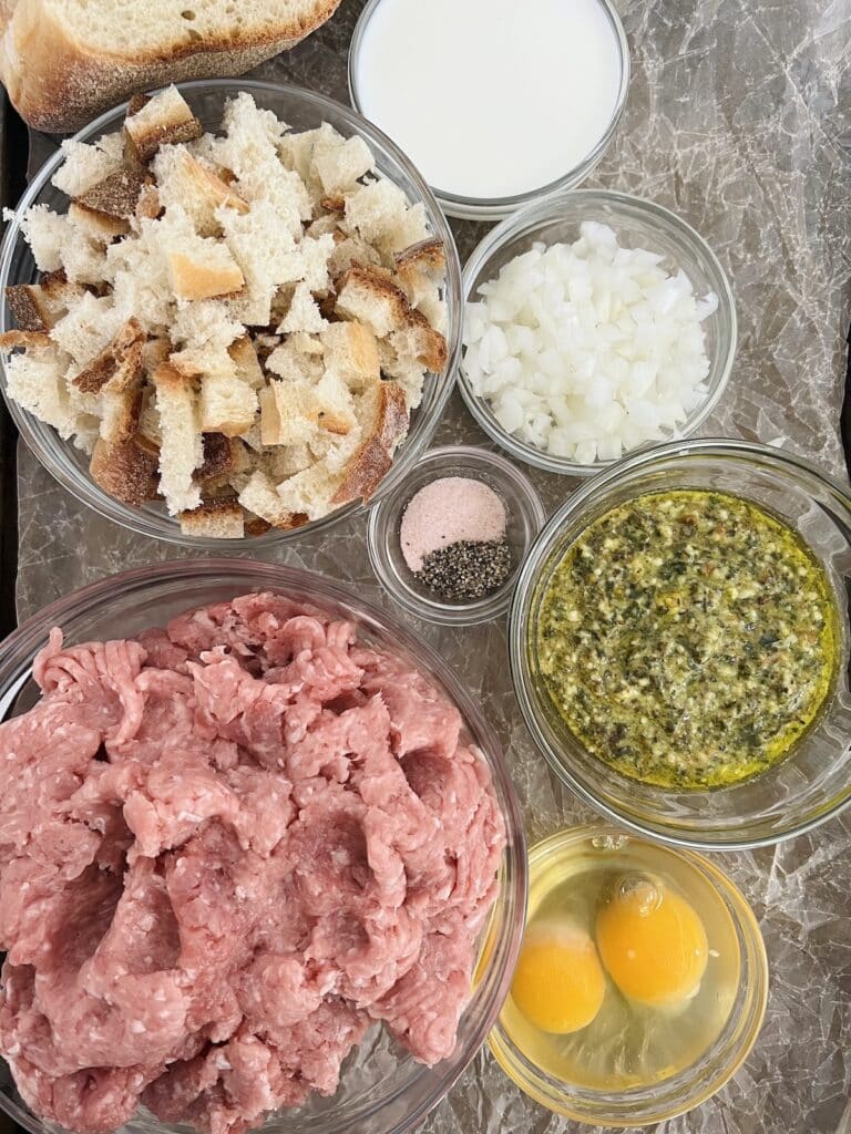 Overhead view of ingredients for easy baked turkey meatballs with pesto.