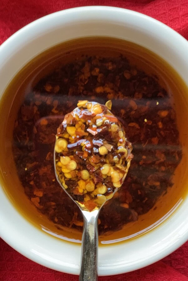 Close-up of finished Italian chili oil on spoon.
