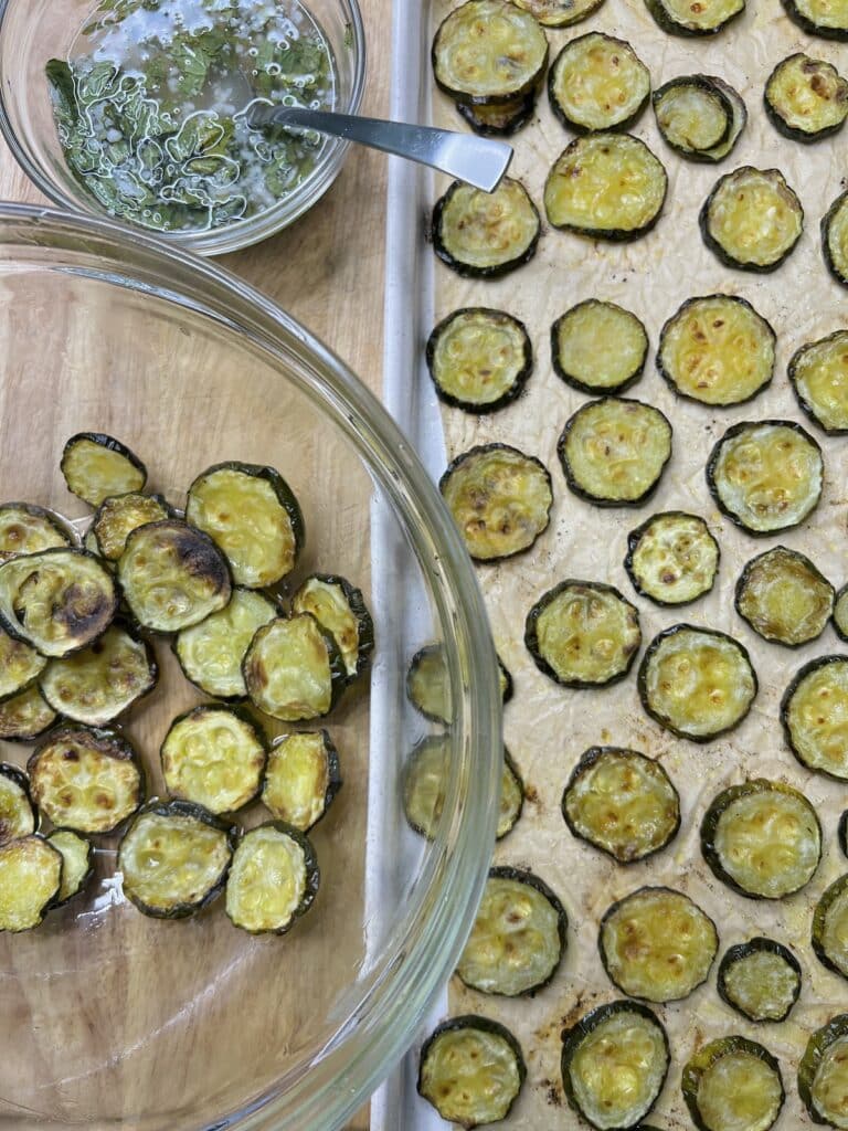 Roasted sliced zucchini in bowl.