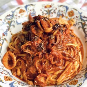 Finished and styled Calamari Pasta in decorative bowl.