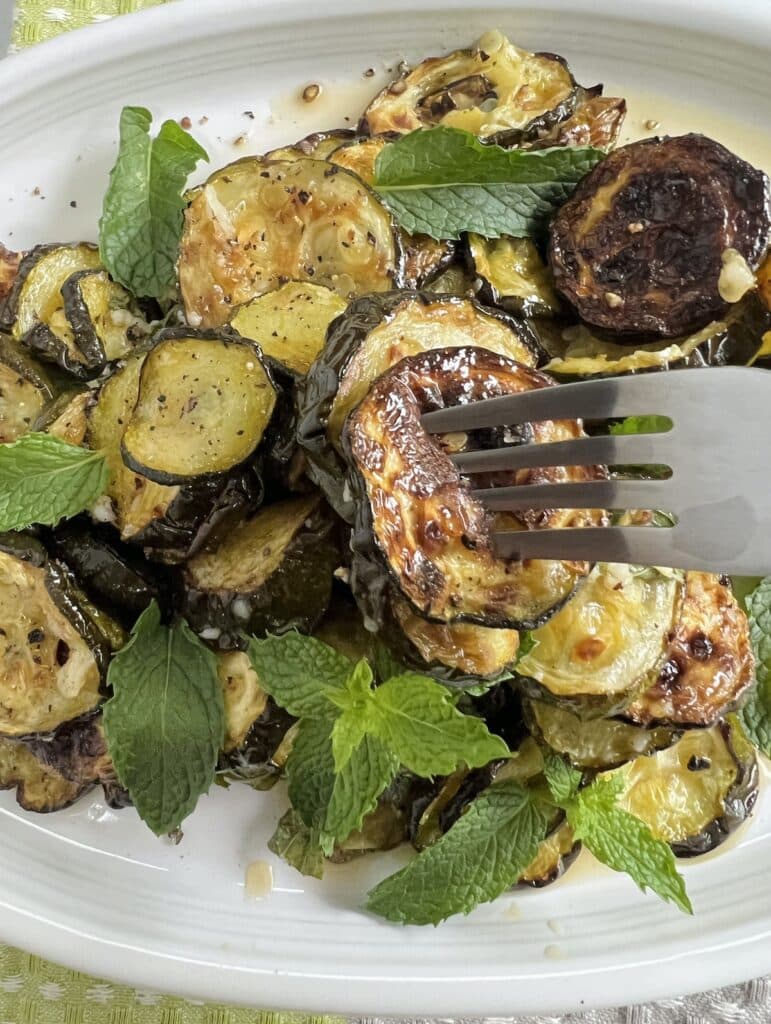 Zucchini alla scapece on fork.