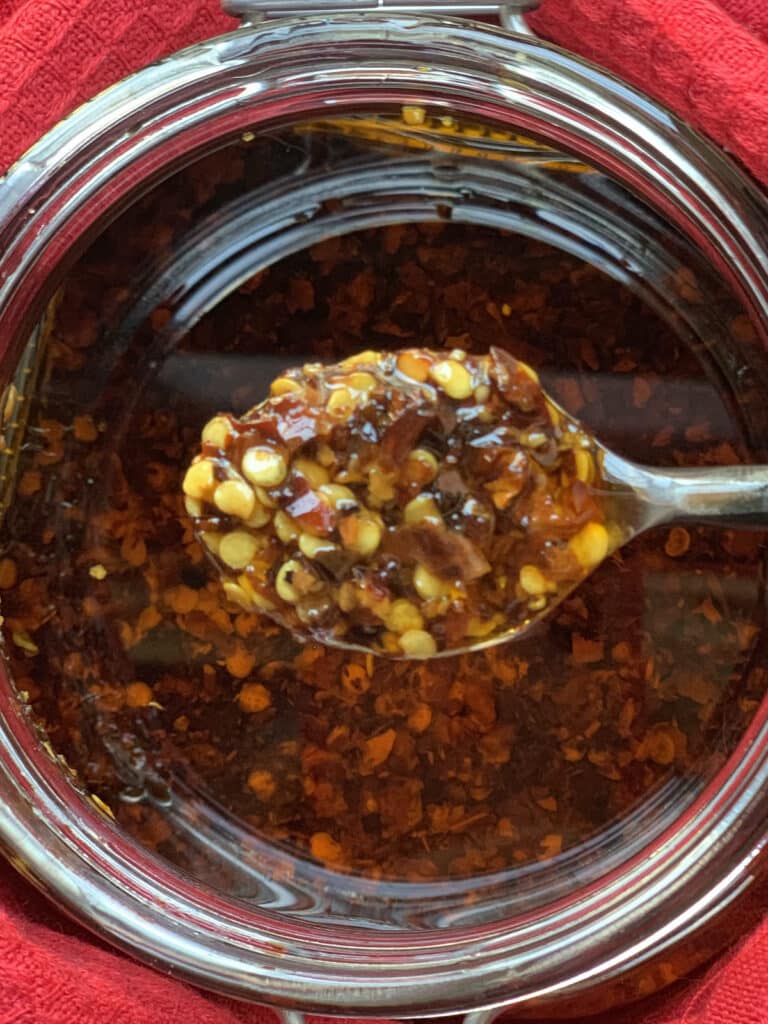 Close-up of finished Italian chili oil on spoon.