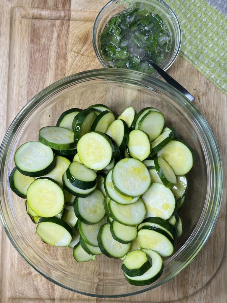 Sliced zucchini tossed with olive oil.