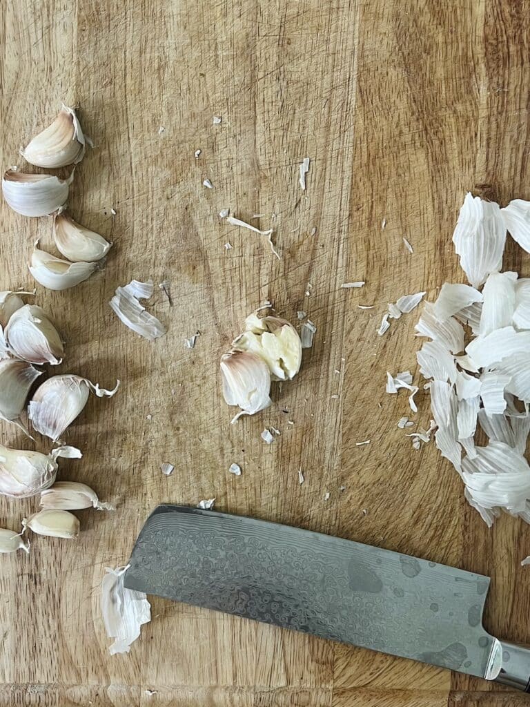 Smashing garlic cloves.