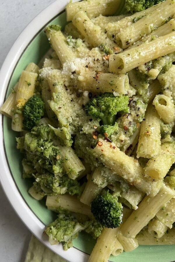 Italian Broccoli Pasta styled in green and white bowl.
