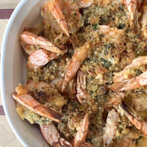 Overhead view of baking pan with finished shrimp oreganata.