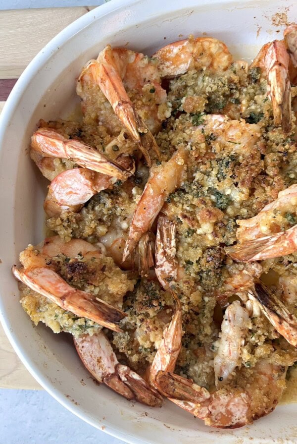 Overhead view of baking pan with finished shrimp oreganata.