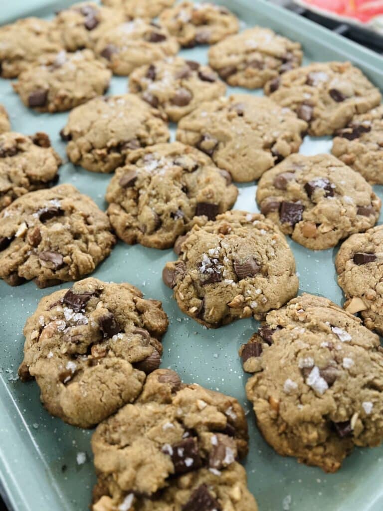 Just baked Salted Peanut Butter Cup Chocolate Chip Cookies on sheet pan.