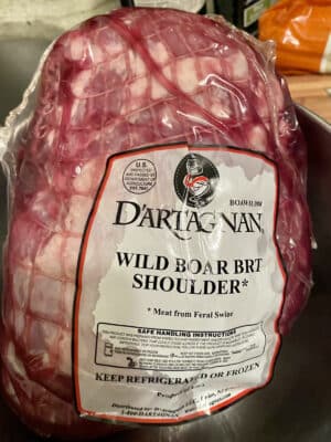 Wild boar shoulder as purchased, in package.