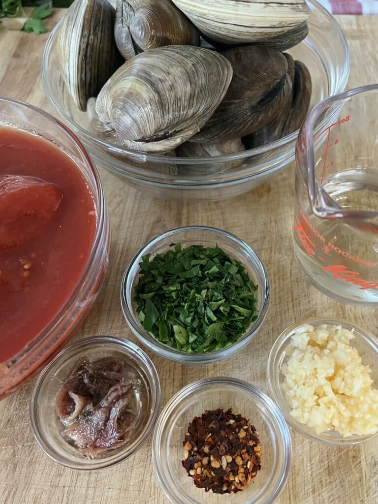 Ingredients for authentic italian red clam sauce.