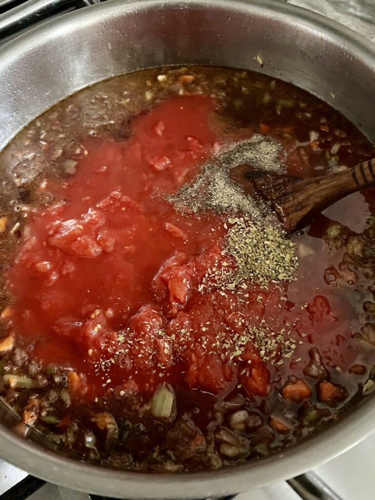 Tomatoes added to pan with vegetables.