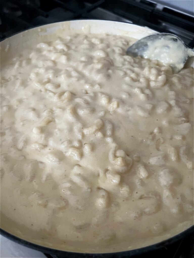 Macaroni and cheese mixed together and resting before serving.