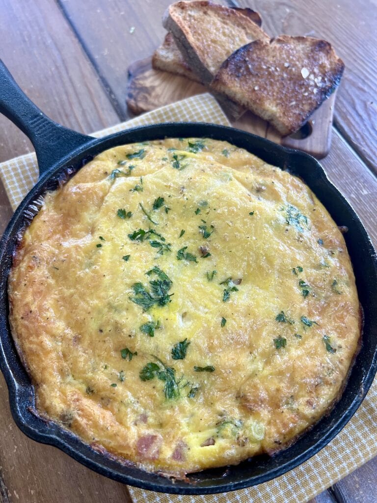 Baked egg frittata in cast iron pan.