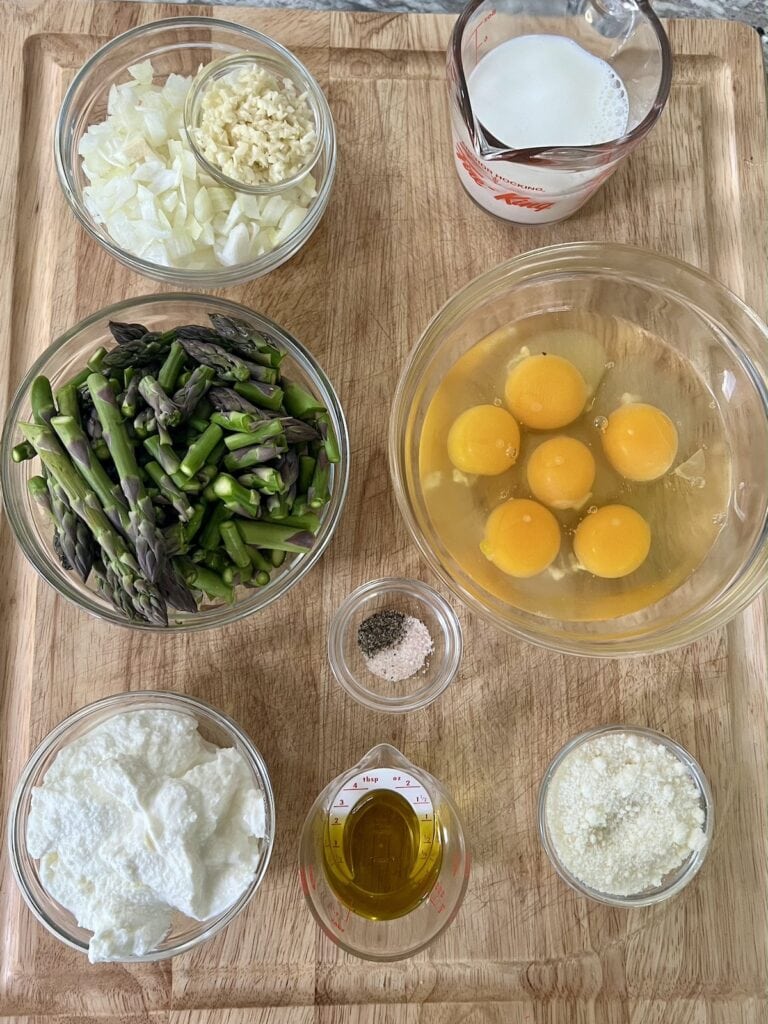 Preppd ingredients for Italian asparagus frittata on cutting board.