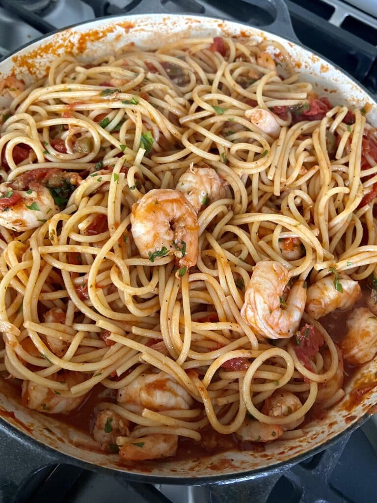Finished shrimp arrabbiata pasta in skillet.