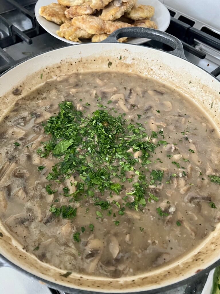 Chopped parsley added to sauce.
