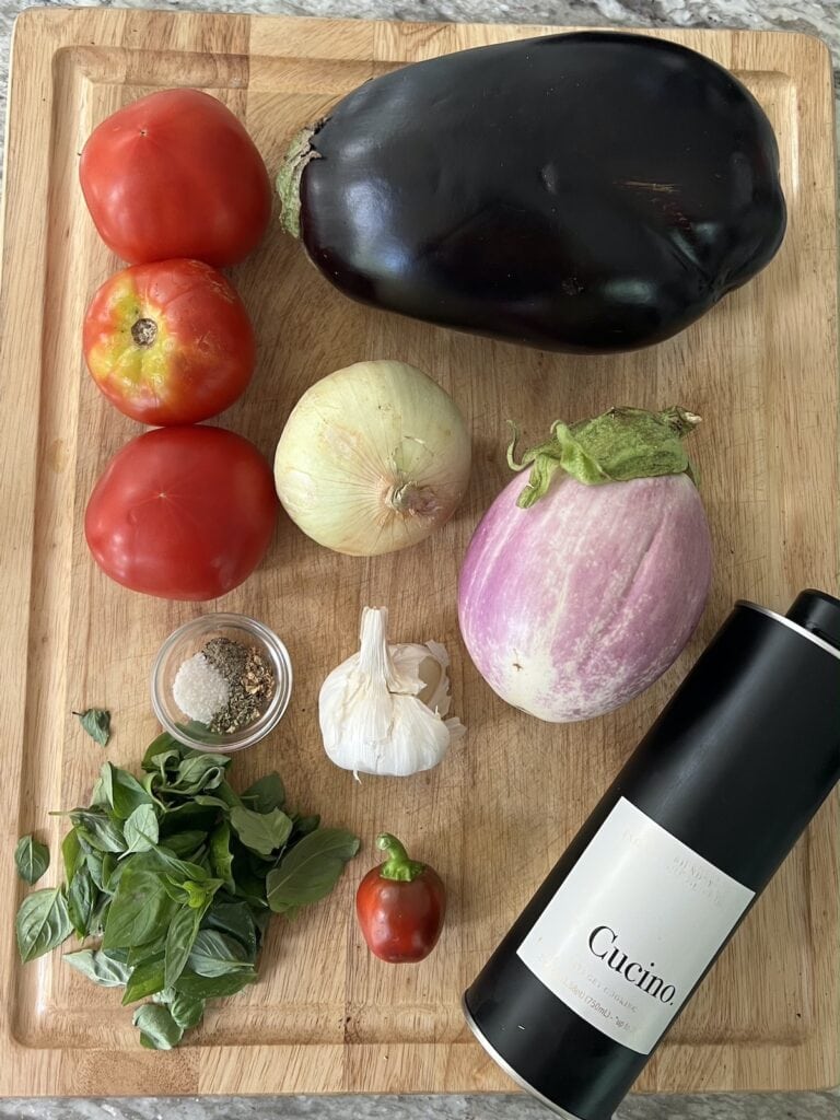 Ingredients for eggplant caviar on cutting board.