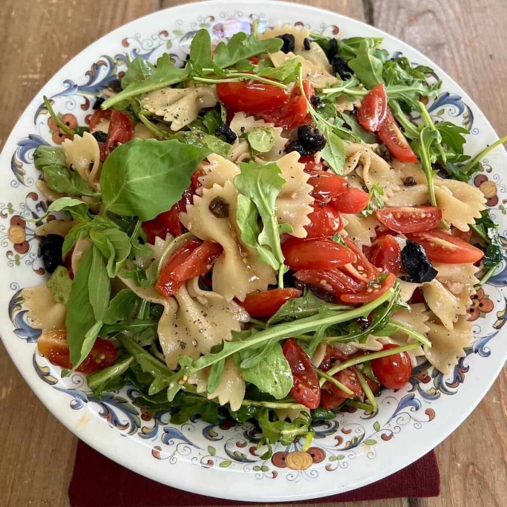 Bowtie pasta salad in decorative bowl.