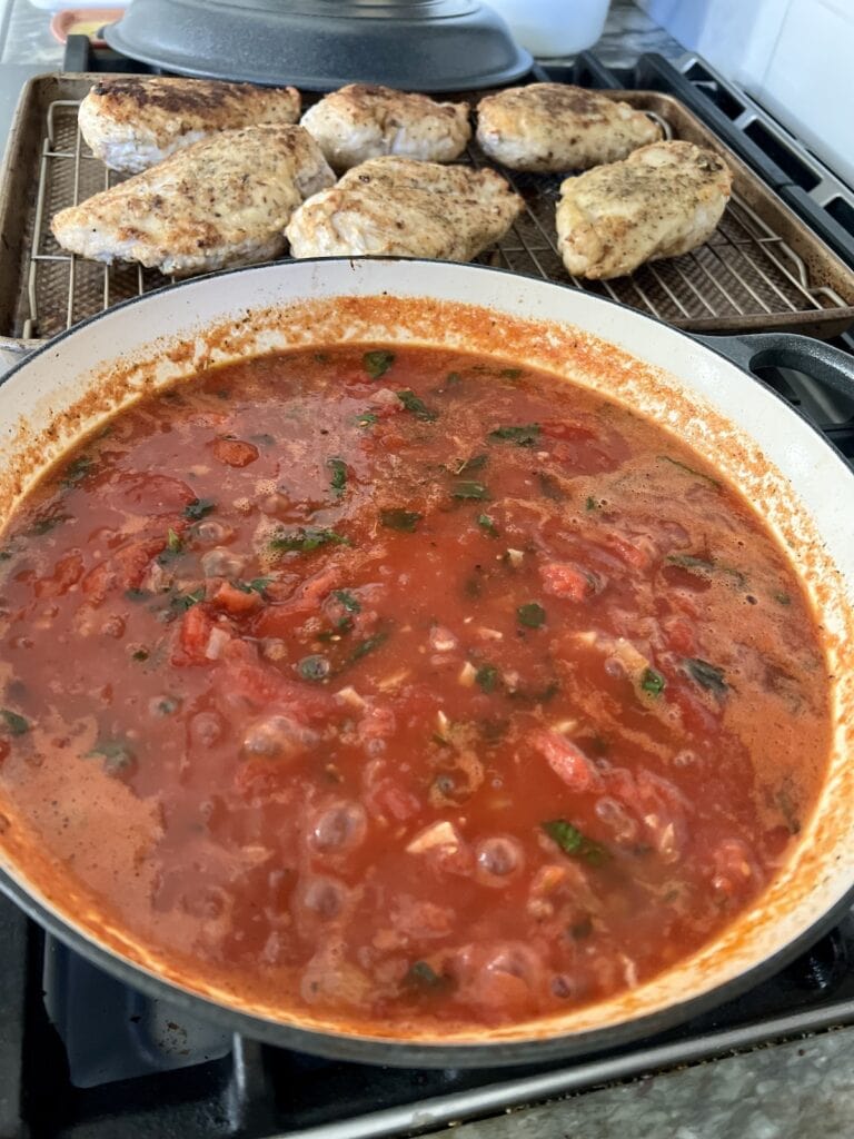 Pomodoro Chicken sauce simmering in pan.