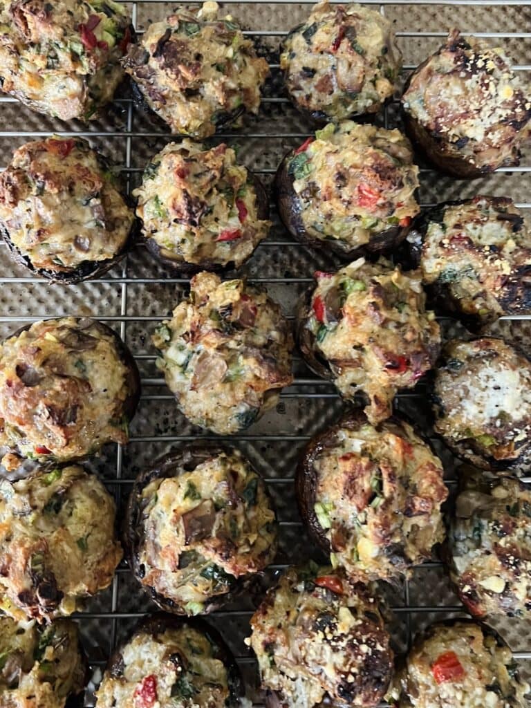 Overhead view of sheet pan full of roasted chicken marsala stuffed mushrooms.