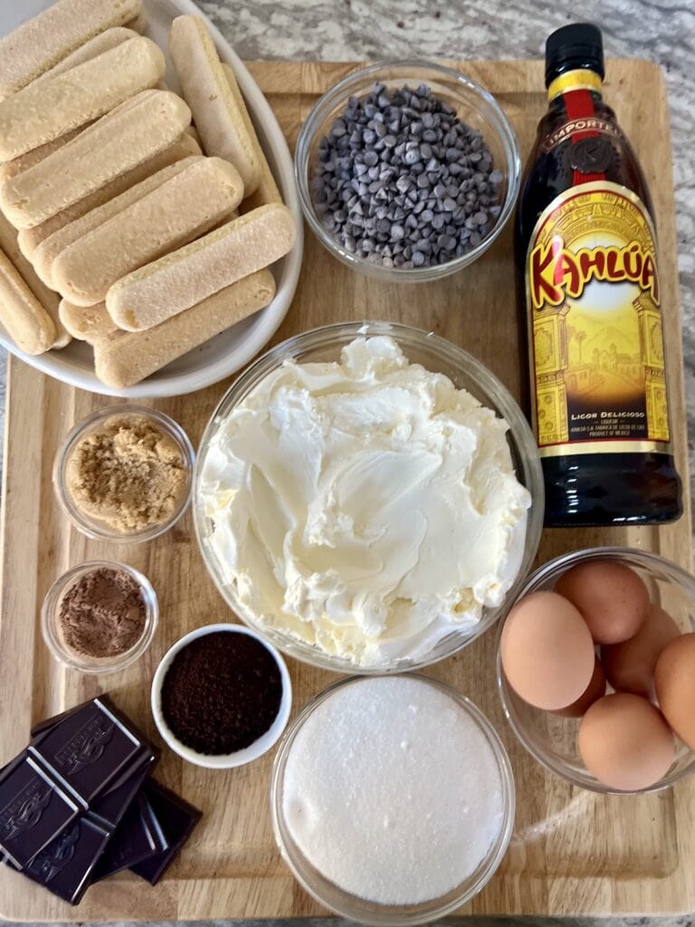 All ingredients for Classic Italian Tiramisu on cutting board.