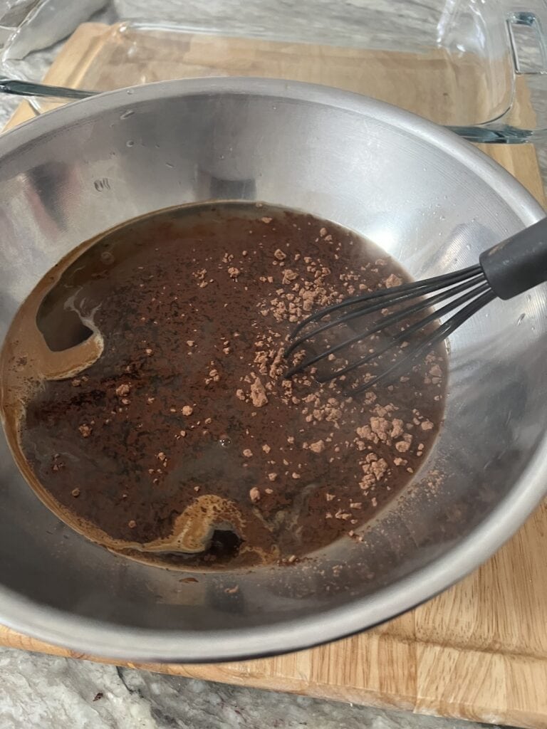 Whisking coffee mixture together.