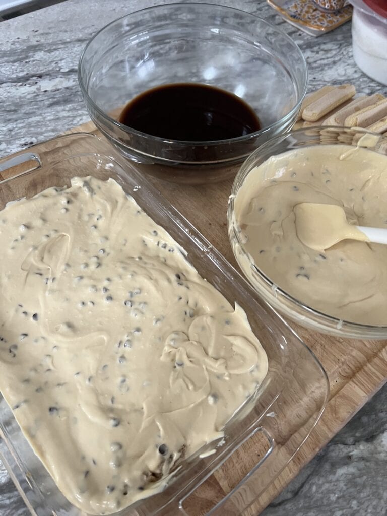 Second (cream) layer completed in glass dish.