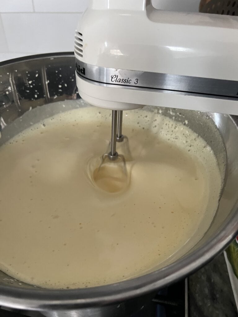 Using hand mixer to finish up the sabayon cream for Tiramisu classico.
