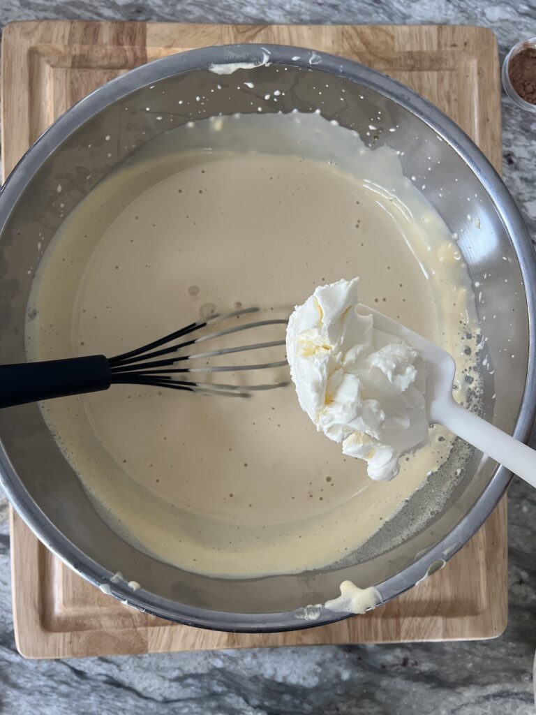 Stirring mascarpone cheese into zabaglione.