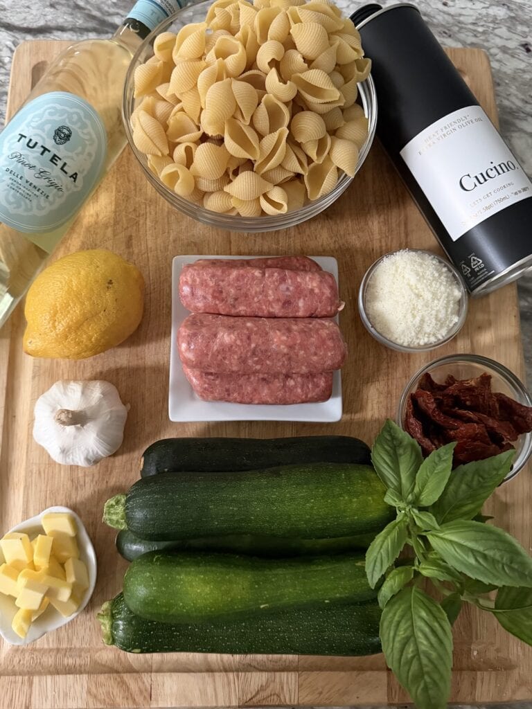 All ingredients for Sausage Zucchini Pasta on cutting board.