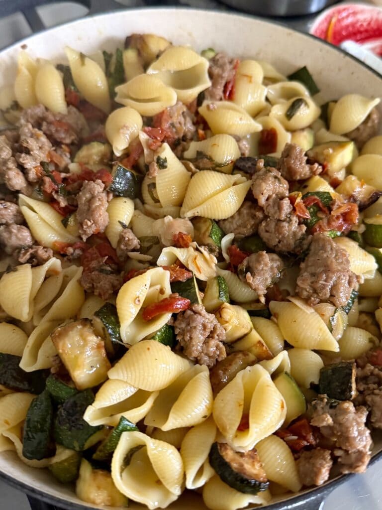 The mixed up pasta in pan.