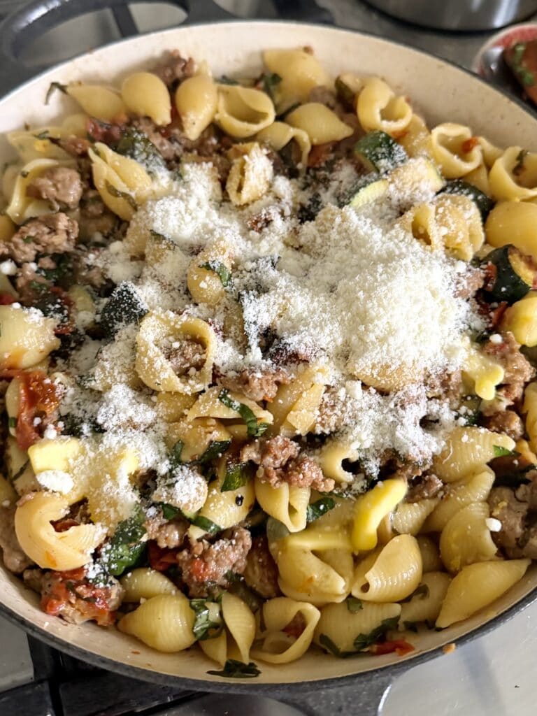 Grated cheese and butter added to pasta. 