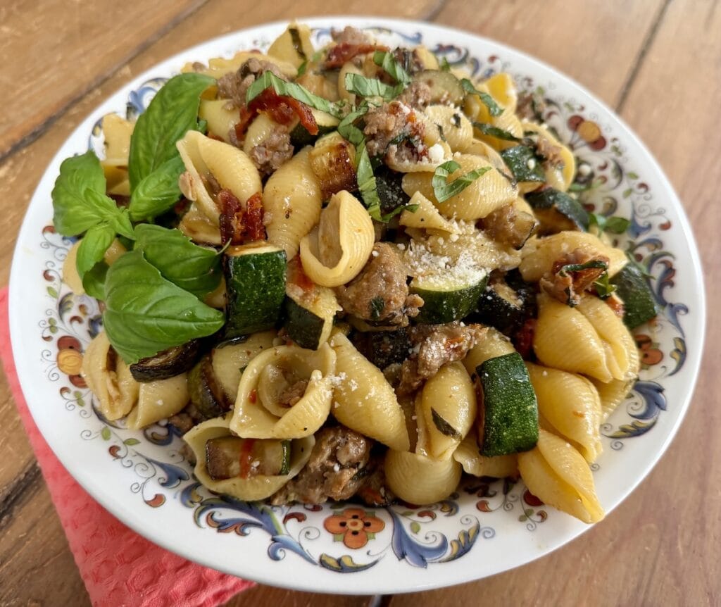 Pasta with Italian sausage and zucchini.