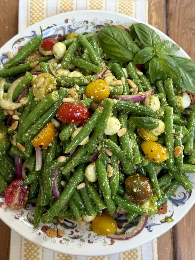 String Bean Salad with Tomatoes and Pesto  in decorative bowl.