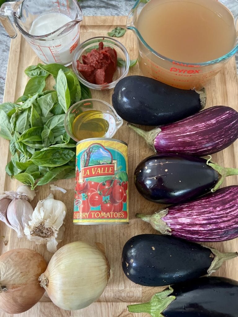 All ingredients for eggplant soup on cutting board.