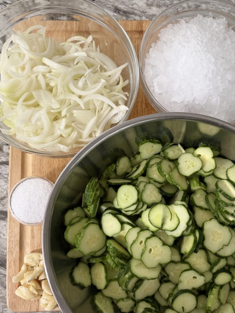 All prepped ingredients for the cucumber onion mixture for quick refrigerator bread and butter pickle recipe.