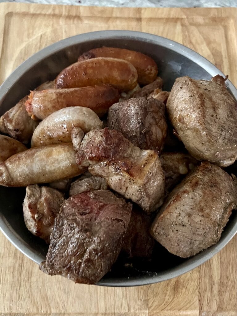 Bowl of seared meat for Sunday gravy.