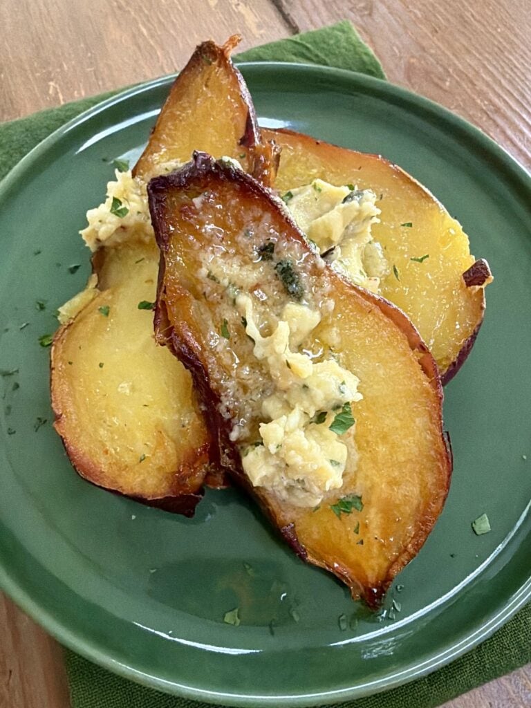 Italian garlic butter dolloped and melting on Japanese sweet potatoes.