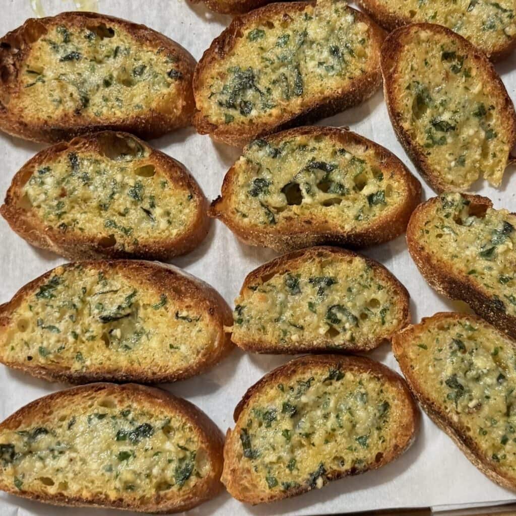 Finished Garlic bread slices just out of the oven.