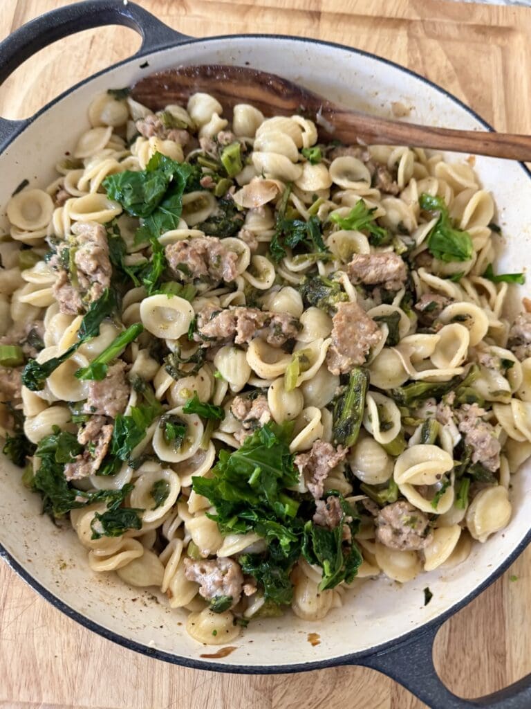 Finished recipe in pan with wooden spoon.