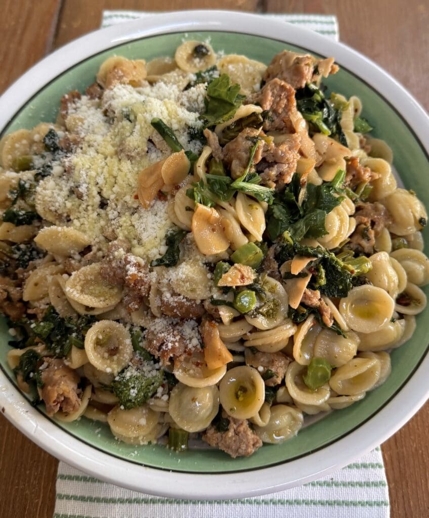 Rapini Sausage Pasta in large decorative pasta bowl.